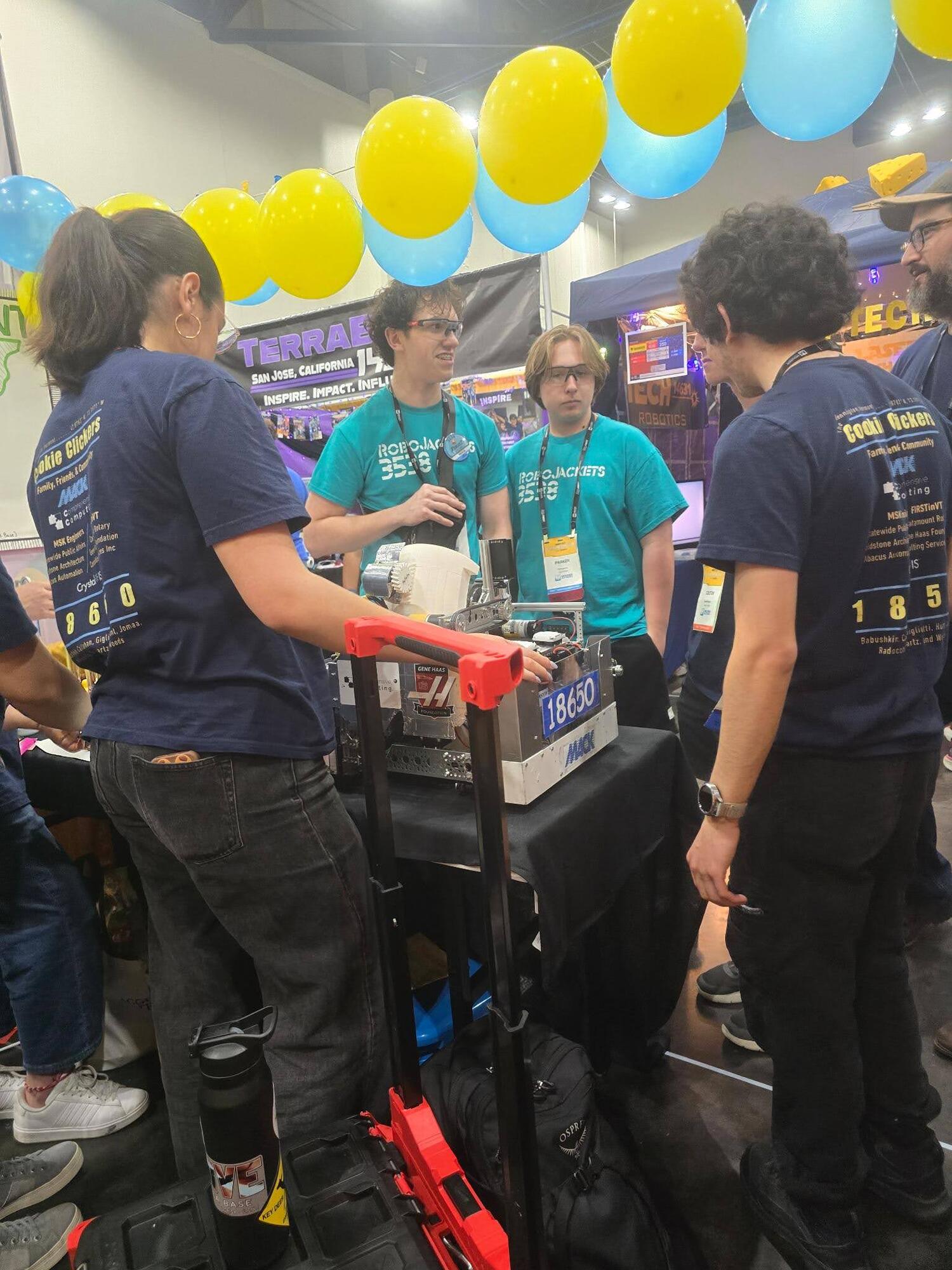 Visitors at the Team 18650 pit during FIRST Championship Houston 2026
