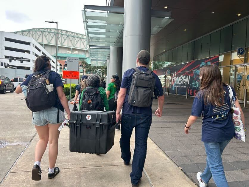 Team 18650 carrying robot and pit gear by hand at FIRST Championship Houston 2026